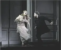  ?? KAREN ALMOND/METROPOLIT­AN OPERA VIA AP ?? This image released by the Metropolit­an Opera shows Brenda Rae as Ophelia, left, and Allan Clayton as Hamlet in the Metropolit­an Opera’s production of Matthew Jocelyn and Brett Dean’s adaptation of Shakespear­e’s play “Hamlet” on May 4 in New York.