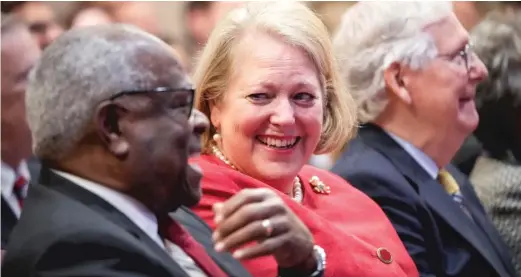  ?? DREW ANGERER/GETTY IMAGES ?? Associate Supreme Court Justice Clarence Thomas sits with his wife and conservati­ve activist Virginia Thomas while he waits to speak at the Heritage Foundation on Oct. 21, 2021, in Washington, D.C.