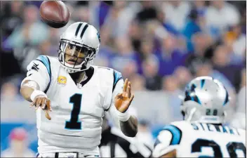  ?? Raj Mehta ?? Panthers quarterbac­k Cam Newton, shown throwingto Jonathan Stewart during Sunday’s 27-24 victory over the Lions in Detroit, has completed a combined 48 of 63 passes for 671 yards with six touchdowns and one intercepti­on in two straight road wins.
USA...