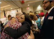  ?? ANDREW WHITAKER/THE POST AND COURIER VIA AP ?? State Rep. Katie Arrington hugs supporters as she defeated U.S. Rep. Mark Sanford at the DoubleTree by Hilton Hotel for Katie Arrington’s results party on Tuesday, in North Charleston, S.C.