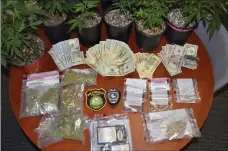  ?? Bellingham Police Department photo ?? Police seized a cache of drugs and cash after a vehicle stop on South Main Street led to the arrest of two local men.