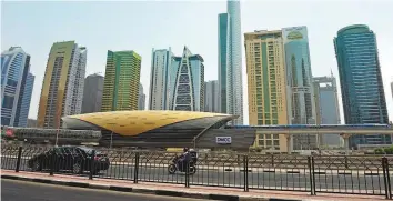  ?? Pankaj Sharma/Gulf News ?? The DMCC metro station as viewed from the Dubai Marina side with Jumeirah Lakes Towers in the background. The proposed walkway is likely to be several hundred metres long as Uptown Dubai is located around 1km from the station and Almas Tower is around 250 metres away.