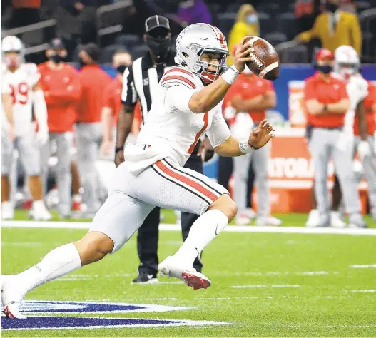  ?? CHRIS GRAYTHEN/GETTY ?? QBJustin Fields made a big impression with six TD passes in Ohio State’s semifinal victory over Clemson.