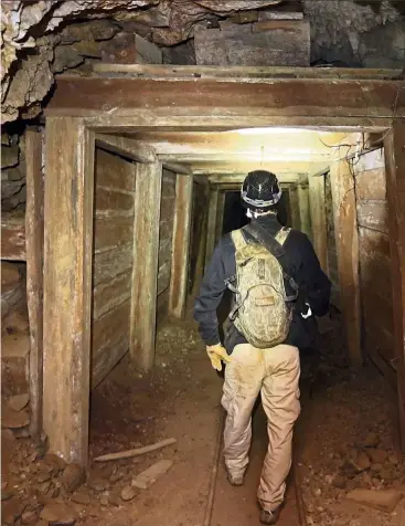  ??  ?? Jeremy MacLee walks through a mine near Eureka, Utah. Underneath the mountains and deserts of the US West lie hundreds of thousands of abandoned mines. Still, not everyone wants to see the mines closed. — Photos: AP Photo/Rick Bowmer