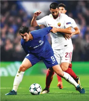  ??  ?? Alvaro Morata of Chelsea and Maxime Gonalons of Roma contest for the ball during the UEFA Champions League match at Stamford Bridge Stadium on 18 October 2017