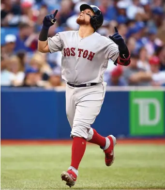  ?? GETTY IMAGES ?? SKY’S THE LIMIT: Christian Vazquez gestures after homering for the third straight game, a solo shot in the fourth inning last night in Toronto. But Chris Sale did not fare well with Vazquez behind the plate as the Red Sox lost to the Blue Jays, 6-3.