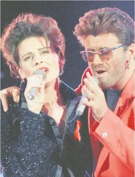  ??  ?? FAME Performing with George Michael at Wembley Stadium in 1992