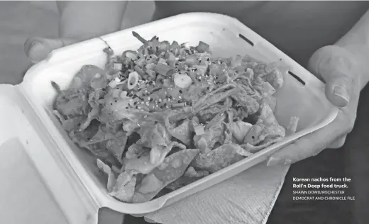  ?? SHAWN DOWD/ROCHESTER DEMOCRAT AND CHRONICLE FILE PHOTO ?? Korean nachos from the Roll'n Deep food truck.