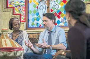  ?? MULUGETA AYENE THE ASSOCIATED PRESS ?? Prime Minister Justin Trudeau sits with Samrawit Moges, left, co-director of Travel Ethiopia, during a meeting with Ethiopian female entreprene­urs in Addis Ababa, Ethiopia, on Sunday.