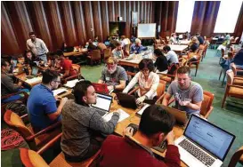  ?? Annie Mulligan ?? Students, staff and community members work together to preserve federal data on Saturday at the Fondren Library at Rice University.