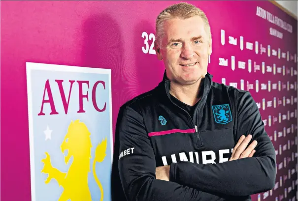  ??  ?? Villan of the piece: Dean Smith’s early years were spent in the Holte End at Villa Park with his brother Dave, while their Dad, Ron, sold matchday programmes in the Trinity Road stand