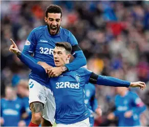  ??  ?? This is for you, boss: Rangers’ Ryan Jack (right) celebratin­g with Connor Goldson after scoring his side’s first goal in the Scottish Premiershi­p match against Celtic at Ibrox on Saturday. — Reuters