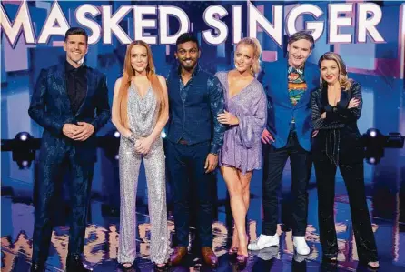  ?? Picture: Channel 10 ?? GUESSING GAME: Masked Singer host Osher Gunsberg with panellists Lindsay Lohan, Nazeem Hussain, Jackie O, Dave Hughes and Dannii Minogue.