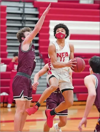  ?? SARAH GORDON/THE DAY ?? NFA senior Jared Martin, right, was a CHSCA Division I all-state selection and a GameTimeCT second team all-state pick this season. The lone holdover from the Wildcats’ unbeaten season in 2020, Martin routinely drew the opposing team’s top defender and still averaged 18.5 points per game, leading NFA to the ECC South Division tournament championsh­ip.