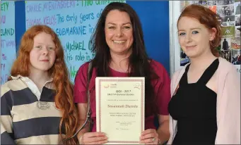  ??  ?? Susannah Durnin pictured with her daughters after she received her QQI Certificat­e in General Studies