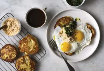  ?? PHOTOS BY ANDREW SCRIVANI, NYT ?? A big breakfast of fried eggs and potato hot cakes with cheddar cream and salsa verde.