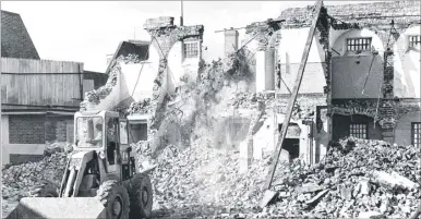  ??  ?? Part of the original prison being demolished in 1965