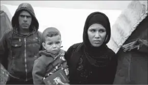  ??  ?? People who just fled Mosul are seen at Al Khazer camp near Hassan Sham, east of Mosul.