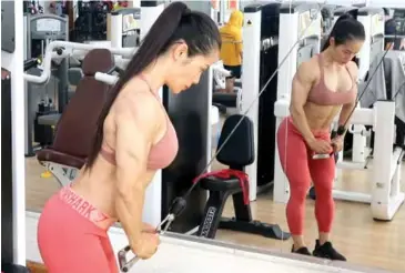  ?? VNS Photo Việt Dũng ?? TRICEPING HARD: Đinh Kim Loan, one of Việt Nam’s most famous female bodybuilde­rs, is both excited and nervous as women are competing in the sport for the first time in SEA Games history.