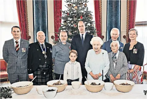  ??  ?? The Queen, the Prince of Wales, the Duke of Cambridge and Prince George join veterans (left to right) Liam Young, Colin Hughes, Alex Cavaliere, Barbara Hurman and Lisa Evans