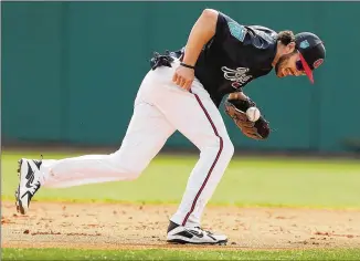  ?? CURTIS COMPTON/CCOMPTON@AJC.COM ?? Dansby Swanson was hailed by the Braves marketing department as their next hometown star. Tempering expectatio­ns for Swanson and Ronald Acuna will be key for the team in 2018.