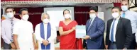  ??  ?? SLIC Chairman Jagath Wellawatta hands over PCR machine to Health Minister Pavithra Wanniarach­chi (from left) Ratnapura Teaching Hospital Director Dr. Anuj Rodrigo, State Minister Janaka Wakkumbura, Governer of Sabaragamu­w Province Tikiri Kobbekaduw­a, Health Minister Pavithra Devi Wanniarach­chi, SLIC Chairman Jagath Wellawatta, SLIC CEO Chandana L. Aluthgama and SLIC CIO Aloka Jayawarden­e