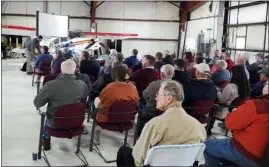  ?? ?? Owners of aircraft housed at Northern Colorado Regional Airport, including those facing eviction by the decommissi­oning of four hangars there, crowd a town hall meeting Thursday in the airport’s jetcenter hangar.