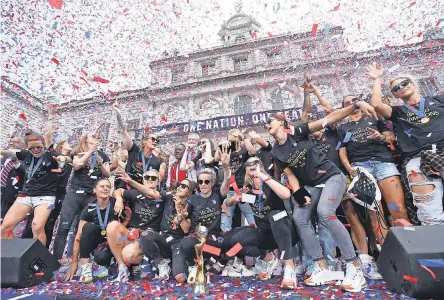  ??  ?? The U.S. women’s national soccer team celebrates Wednesday at City Hall in New York. BRAD PENNER/USA TODAY SPORTS