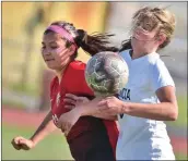  ?? Dan Watson/The Signal ?? Hart High’s Giselle Montiforte (23) and Valencia High defender Jordan Henderson (6) fight for a pass at Hart High School on Friday.