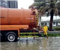  ??  ?? Heavy rains caused water logging in 22 places in Dubai. The civic body formed an emergency team to make the city clean.