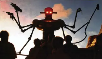  ?? FABIAN BIMMER / ASSOCIATED PRESS 2000 ?? A robot display greets visitors to Expo 2000 in Hanover, Germany. For some observers, robots “are just the next generation of tools,” while for others, their worries perhaps stoked by science-fiction dystopias, the rise of these AI machines poses a...
