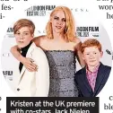  ?? ?? Kristen at the UK premiere with co-stars Jack Nielen and Freddie Spry who play Princes William and Harry