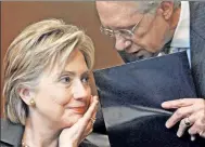  ?? AP ?? Sen. Reid having a word with Hillary Clinton.