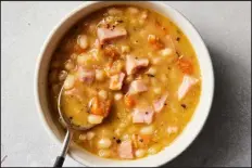  ?? CHRISTOPHE­R TESTANI — THE NEW YORK TIMES ?? Hearty and comforting, this soup is a great way to use the ham hock or any leftover ham from a holiday meal.