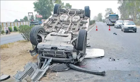  ?? HT FILE ?? A car that overturned after hitting a tractor from the rear at Manawala village, 8km from Amritsar on June 12, 2016. According to the data compiled by the transport research wing of the Union road transport and highways ministry, as many as 102 persons...