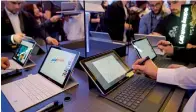  ?? — AFP ?? Visitors check out the samsung Galaxy Book tablet after its presentati­on in Barcelona on the eve of the official opening of the World mobile Congress.