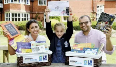  ??  ?? From left: Holme Grange teacher, Victoria Carberry and pupil Ava (8) wih Av Raichura, Community Affairs Manager for Amazon, who presented Ava with her prizes