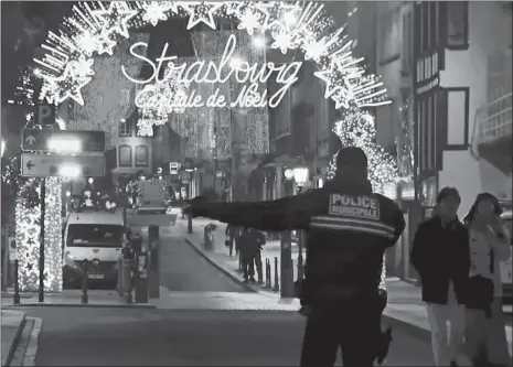  ?? AP PHOTO ?? In this image made from video, emergency services arrive on the scene of a shooting Tuesday near a Christmas market in Strasbourg, France.