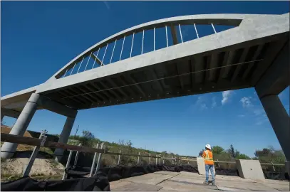  ?? DOUG DURAN — BAY AREA NEWS GROUP ?? Augie Blancas, an Informatio­n Officer with the California High-Speed Rail Authority, is photograph­ed near a viaduct bridge constructe­d for the California High-Speed Rail that spans the San Joaquin River in Fresno., on Thursday, April 1.