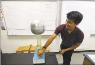  ?? Matthew Brown / Hearst Connecticu­t Media file photo ?? Benjamin Faiz, an 8th grade science teacher at Cloonan Middle School, plays with a Electrosta­tic Generator on Sept. 6 in Stamford.