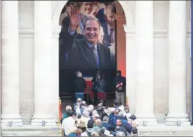  ?? JACK CHAN / XINHUA ?? People line up to pay tribute to former French president Jacques Chirac at the Hotel des Invalides in Paris on Sept 29.