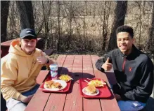  ?? MICHAEL GWIZDALA — MEDIANEWS GROUP ?? Anthony Signorelli and Joseph Philistin, of Troy, enjoy lunch on the 82nd annual opening day of Jack’s Drive In in Wynantskil­l.