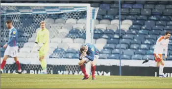  ??  ?? SINKING FEELING Blues midfielder Andy Cannon puts his head in his hands after Blackpool’s goal