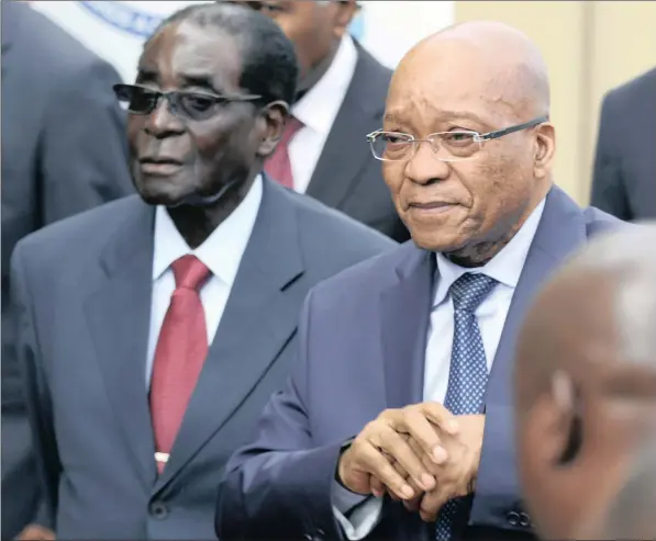  ??  ?? UNTOUCHABL­E?: Zimbabwean President Robert Mugabe and President Jacob Zuma at a recent summit of the SADC. The writers say it seems unlikely that the regional body would be persuaded by Ecowas interventi­on in The Gambia to act against its own.