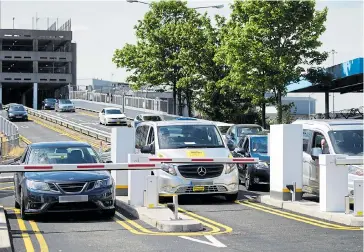  ??  ?? Vehicles wait to exit Manchester Airport after the introducti­on of new Kiss And Fly charges