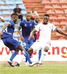  ??  ?? Bilya Aliyu of Gombe United (L) and Etim Mathew of Rangers contest for the ball during their recent league match in the NPFL