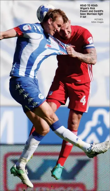  ?? PICTURES: Action Images ?? HEAD TO HEAD: Wigan’s Nick Powell and Cardiff’s Sean Morrison fight it out