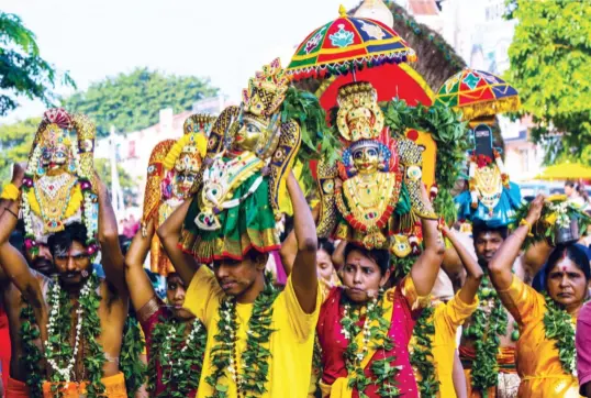  ??  ?? BELOW Hindu devotees and the kavadi in a procession to the temple on Thaipusam day, a day of thanksgivi­ng and devotion RIGHT Legong traditiona­l Balinese dance in Ubud, Bali, Indonesia