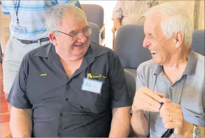  ??  ?? Knowledge Bank founder James Morgan (right) chats with volunteer John Newson after the launch of the new website.