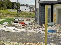  ?? AMANDA SAXTON / FAIRFAXNZ ?? Food packaging, cigarette cartons and constructi­on waste litter constructi­on sites of Flat Bush.